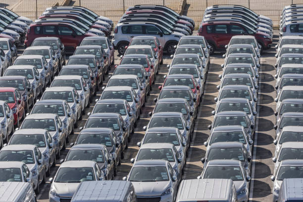 New cars standing in a row on parking lot