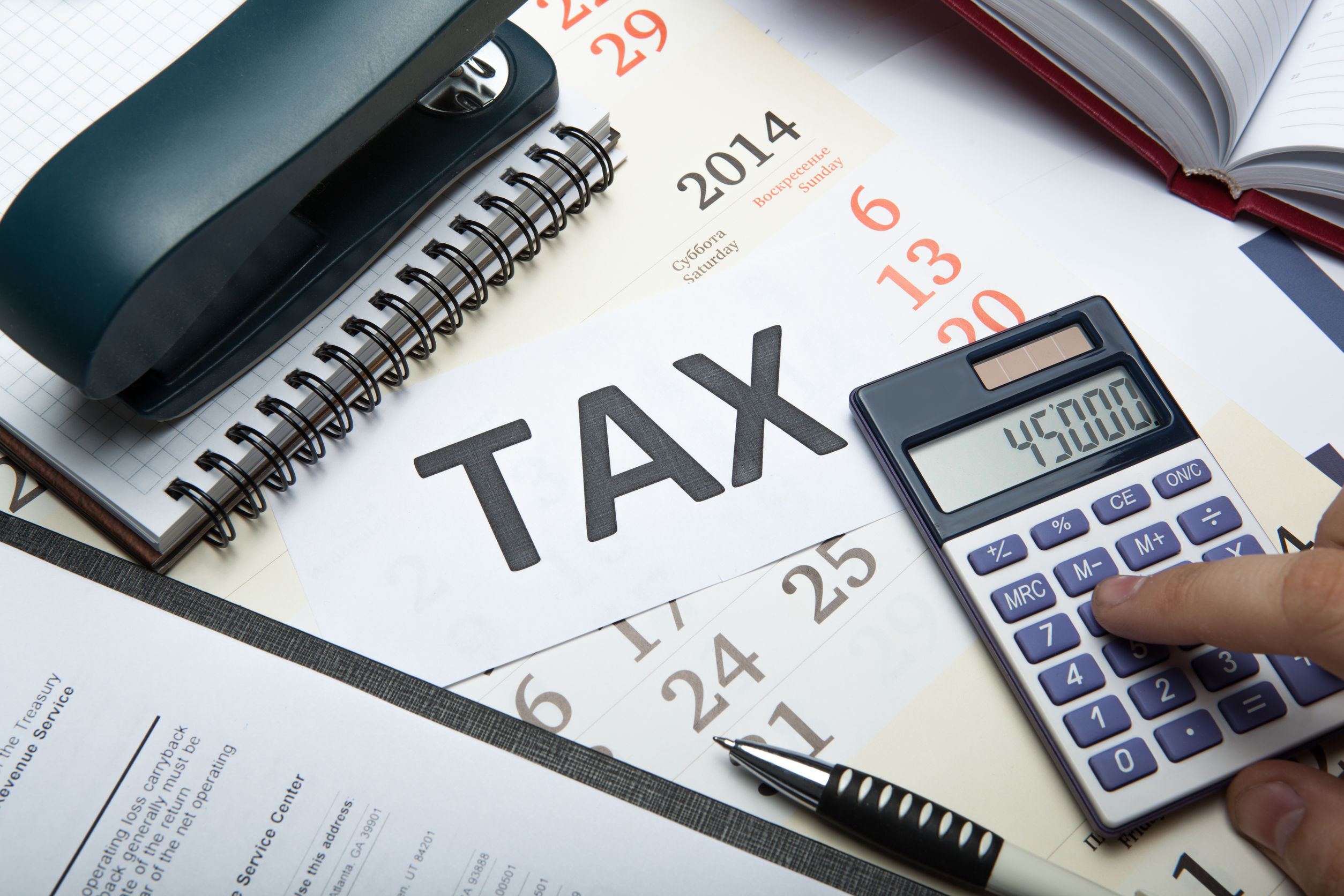 44968867 - office work and filling in tax returns close up